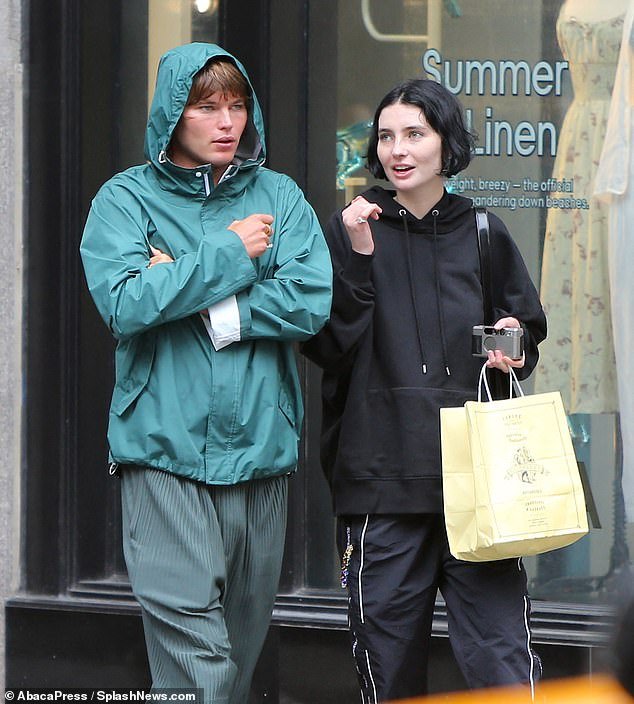 Chatty: Australian star Jordan, 25, stayed close his pal, as they walked along sharing an aminated conversation