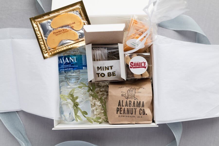 A guest gift box filled with water, Alabama peanuts, mints and more.