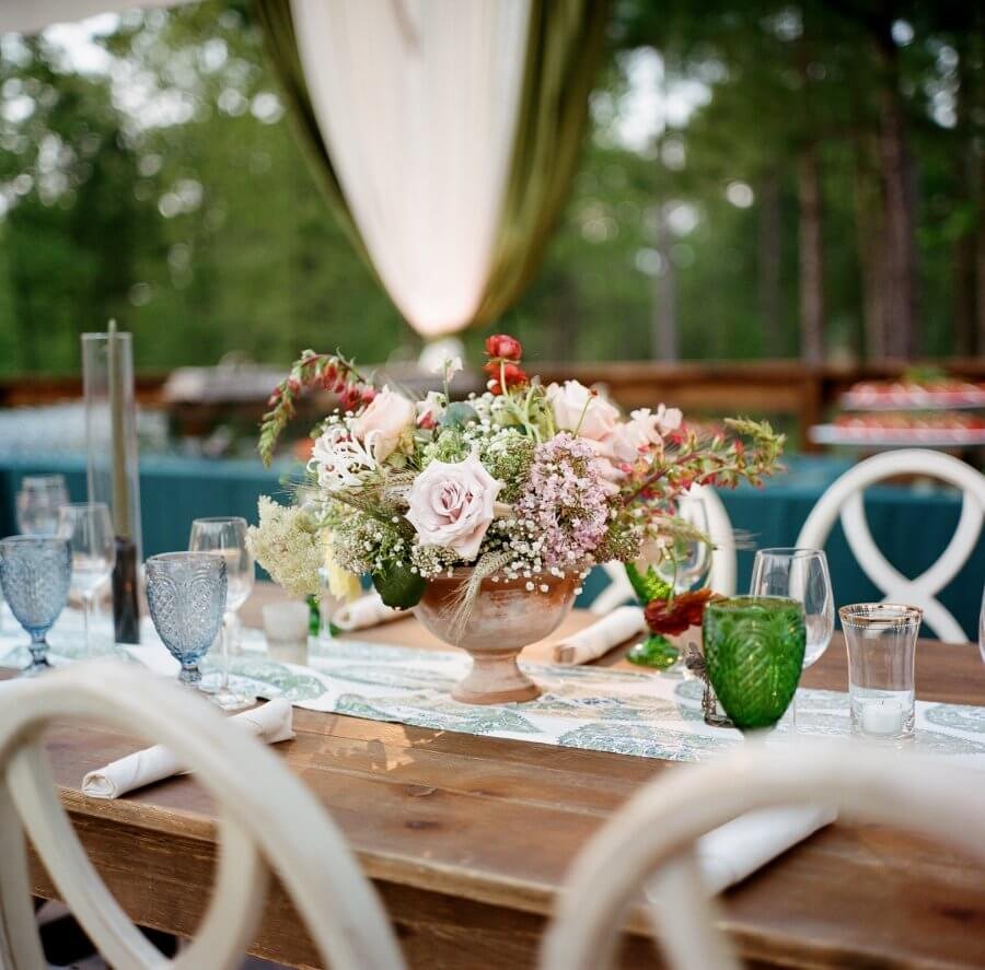 A mini floral arrangement on a reception table.