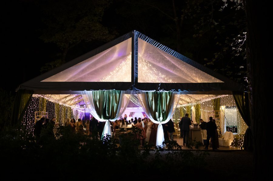 Hansell and Matt's wedding tent lit up at night