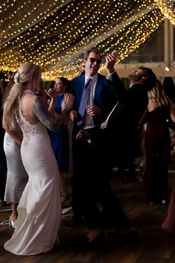 The bride and groom dance
