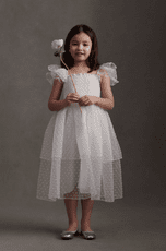white flower girl dress with dimensional polka dots