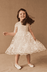 Flower girl dress with a floral overlay