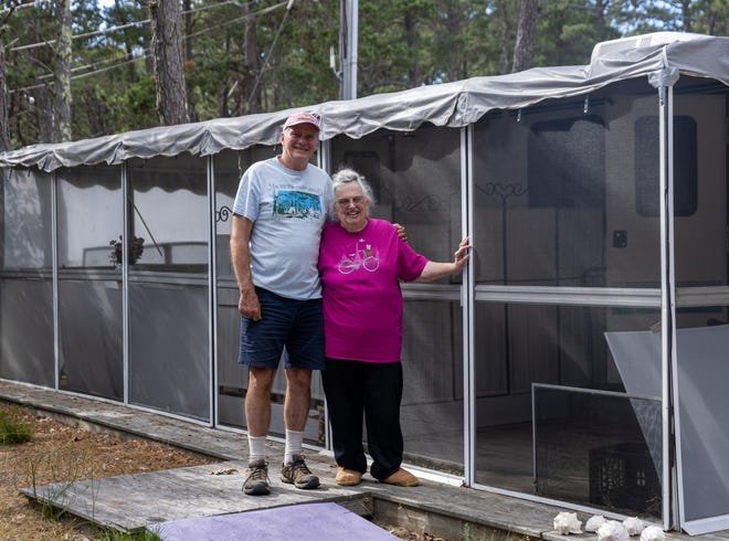 Maurice's Campground owner John Gauthier, left, and Melinda Brotherton, 85, of New Hampshire, pose in front of Brotherton's trailer at the South Wellfleet campground. This summer marks the seventh year Brotherton has stayed at Maurice's.