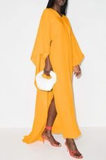 long-sleeved mustard color cape gown